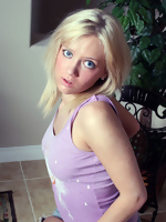 My blonde girl-friend posing for camera in full clothes
